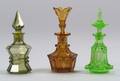 Three Molded Colored Glass Colognes