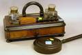 Ebonized and Burl Veneer Desk Caddy with Inkwells and Ebonized Turned Wood Hand Mirror and Brush