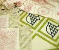 Pieced Cotton Quilt and a Figural Embroidered Cotton Coverlet with a Pair of Pillow Covers