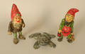 Two cast iron dwarf doorstops together with a frog doorstop