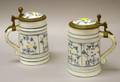 Two German Porcelain Blue Flute Decorated Tankards