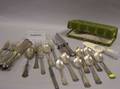 Approximately Seventyfive Pieces of Assorted Silver Plated Flatware a Sterling Silver Carving Set and a Coin Spoon