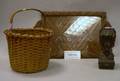Woven Splint Gathering Basket a Carved Wood Tray and Bust Furniture Element