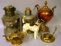 Painted Cast Iron Terrier Doorstop a Brass and a Copper Kettles on Stand a Wilcox  Crittenden Ships Lantern and a Ships Masthead