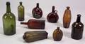 Nine Blown Colored Glass Bottles