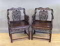 Pair of Chinese carved armchairs