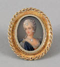 18K yellow gold framed painted female portrait brooch