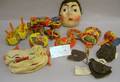 Collection of Halloween Lithographed Tin Noisemakers and Five Painted Masks