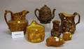 Two Rockingham Glazed Molded Stoneware Pitchers and Five Assorted Rockingham Glazed Items