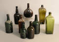 Nine glass bottles