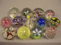 Twelve Art Glass Paperweights and a Perfume Bottle