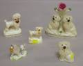 Four Small Staffordshire Spaniels and a Figural Group