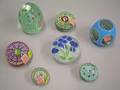 Five Assorted Millefiore Glass Paperweights and Two Floral Glass Paperweights