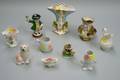 Ten Assorted Small Staffordshire and Paris Porcelain Vases Figures Tobys and Table Items and a Green Etched