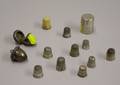 Nine Sterling and Coin Silver Thimbles Two Acornform Thimble Cases and a Spool Thread Case