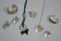 Group of Eight Southwestern Silver Bracelets Necklaces and Pins