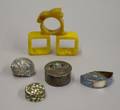 Four Silver and Enamel Gemset Boxes and Three Bakelite Napkin Rings