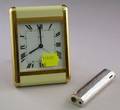 Cartier Paris Brass and Enamel Travel Alarm Clock and a Tiffany  Co Lighter
