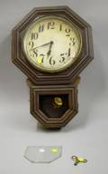 E Ingraham 10 in Ingot Oak Cased Drop Octagon Wall Clock