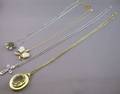 Four 14kt Gold Pendant Necklaces