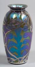 Silver overlay art glass vase Art Nouveau stylized floral overlay on a green iridescent body with blue iridescent stylized leaf st