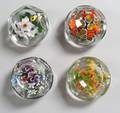 Four Rick Ayotte Faceted Glass Paperweights