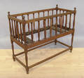 Turned walnut crib