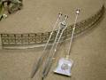 Bowed Pierced Steel Fireplace Fender and a Set of Three Steel Fireplace Tools