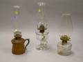 Two Colorless Glass Kerosene Lamps and a Turned Wood Base Lamp
