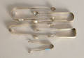 Five American silver sugar tongs marked IC
