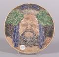 Continental Pottery Roundel of Jolly Bacchus