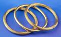 Three 18kt Gold Oval Hinged Bangles