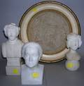 Group of Carvings two folktype white marble busts composition molded bust of Washington and a framed castmarble plaque of
