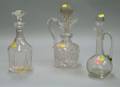 Two Colorless Cut Glass Decanters and a Blown Glass Decanter