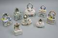 Eight Assorted Staffordshire Porcelain Figural Trinket Boxes