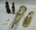 Two New Guinea Tuskmounted and Shellencrusted Carved Wood Masks and Two Rope and Shell Embellished Carved Wood Figures