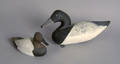 Two duck decoys to include a miniature canvasback drake signed Don Beshore 79