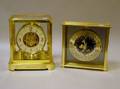 Le Coultre Brass and Glass Atmos Clock and a Seiko Brass International Time Table Clock