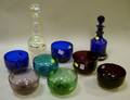 Seven Colored Blown Glass Finger Bowls a Cobalt Glass Decanter and a Glass Millefiore Paperweight Decanter