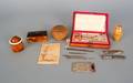 Elaborate gold and mother of pearl cased sewing kit