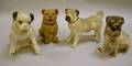 Three Chalkware and One Plaster Pug Figures