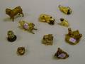Group of Nine Metal Pugrelated Articles and a Miniature Painted Ceramic Basket of Pugs Figural Group