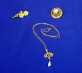 Two Brooches and a Necklace