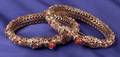 Pair of 14kt Gold and Gemset Bangle Bracelets India