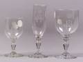 Three Colorless Etched Glass Wine Glasses
