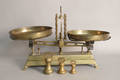 Large brass balance scale with pans and weights