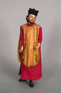 Continental carved and painted figure of a cleric early 19th c