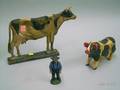 Painted Cast Iron Cow Doorstop Amish Farmer Figure and a Carved and Painted Wooden Pig Figure