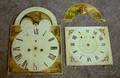 Two Clock Dials and a Fragment
