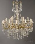 Louis XV Style Brass and Colorless Glass EighteenLight Chandelier